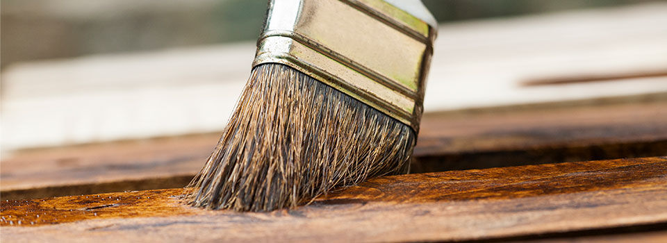 Paint brush staining wood